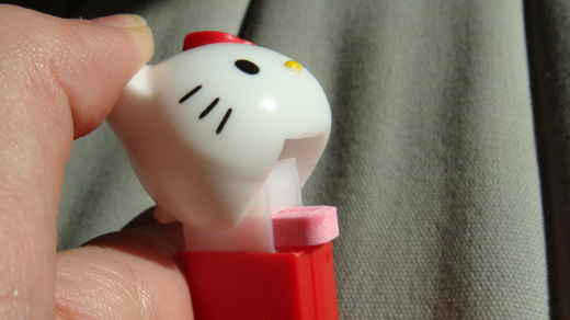 hello kitty pez dispenser with hand and candy